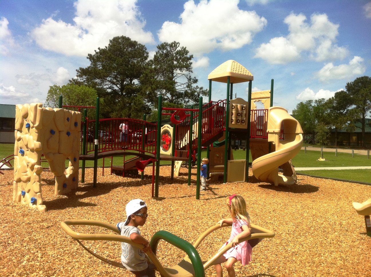 Newly renovated Lake Mayer playground three new climbing structures complete with climbing walls, tunnels; plus new swing sets, new baby swing sets, new mulch, new swivel seat, new twirling toy & oh-so-modern sleek see-saw!